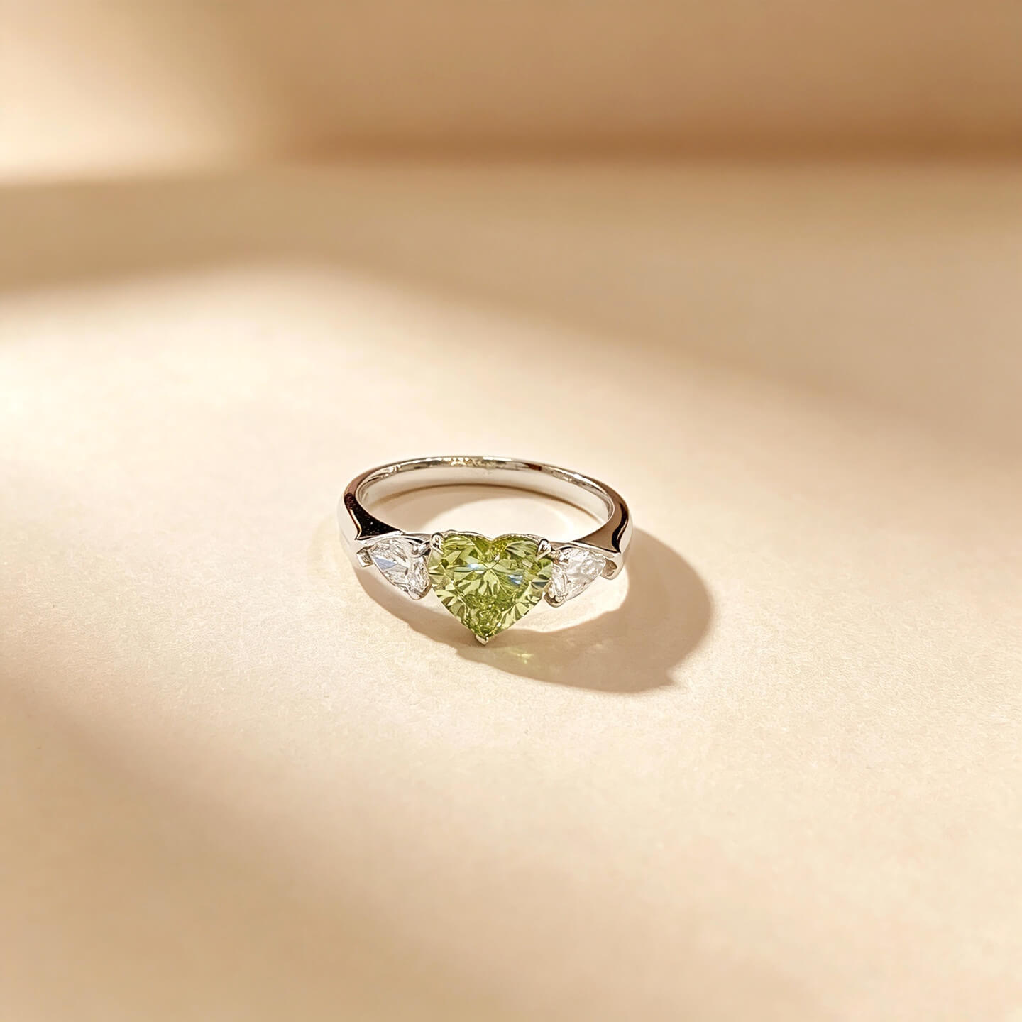 Heart cut lab grown green diamond three stones engagement ring