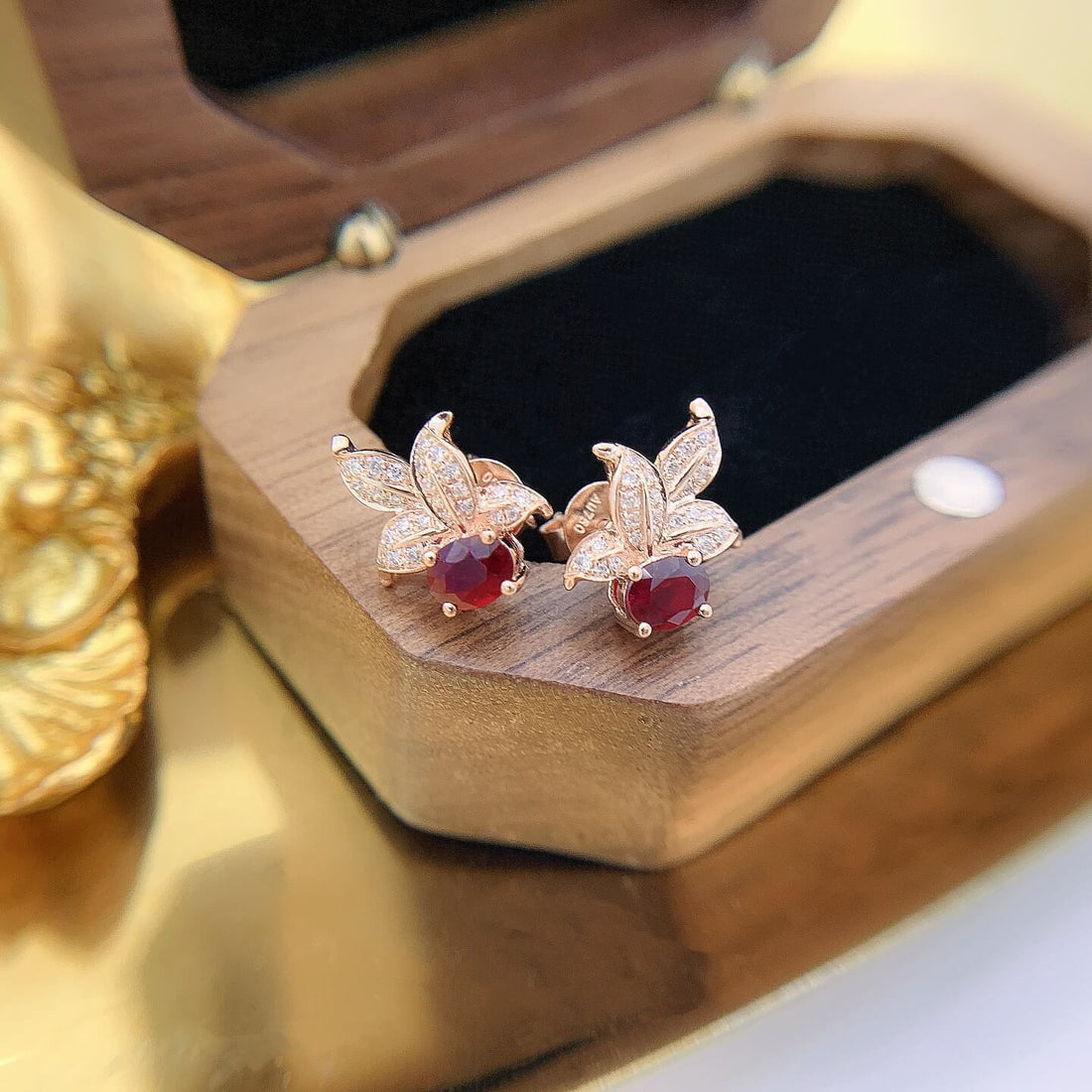 Leaves design oval cut lab grown ruby earrings stud