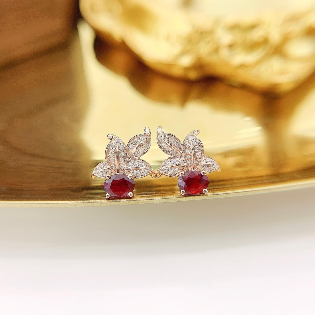 Leaves design oval cut lab grown ruby earrings stud