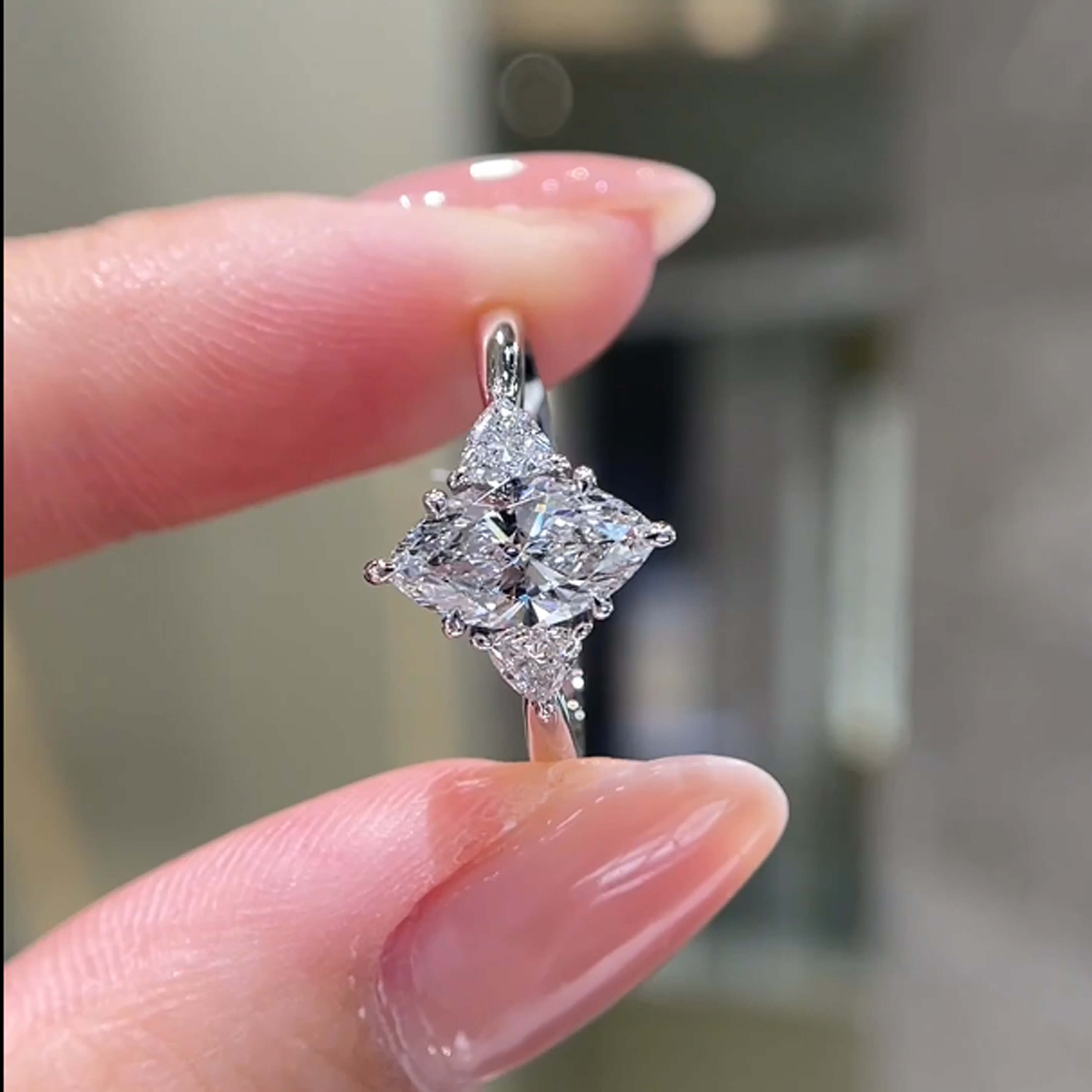 Marquise cut lab grown diamond three stones engagement ring
