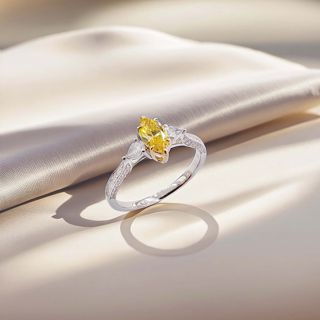 Marquise cut lab grown yellow diamond three stones engagement ring
