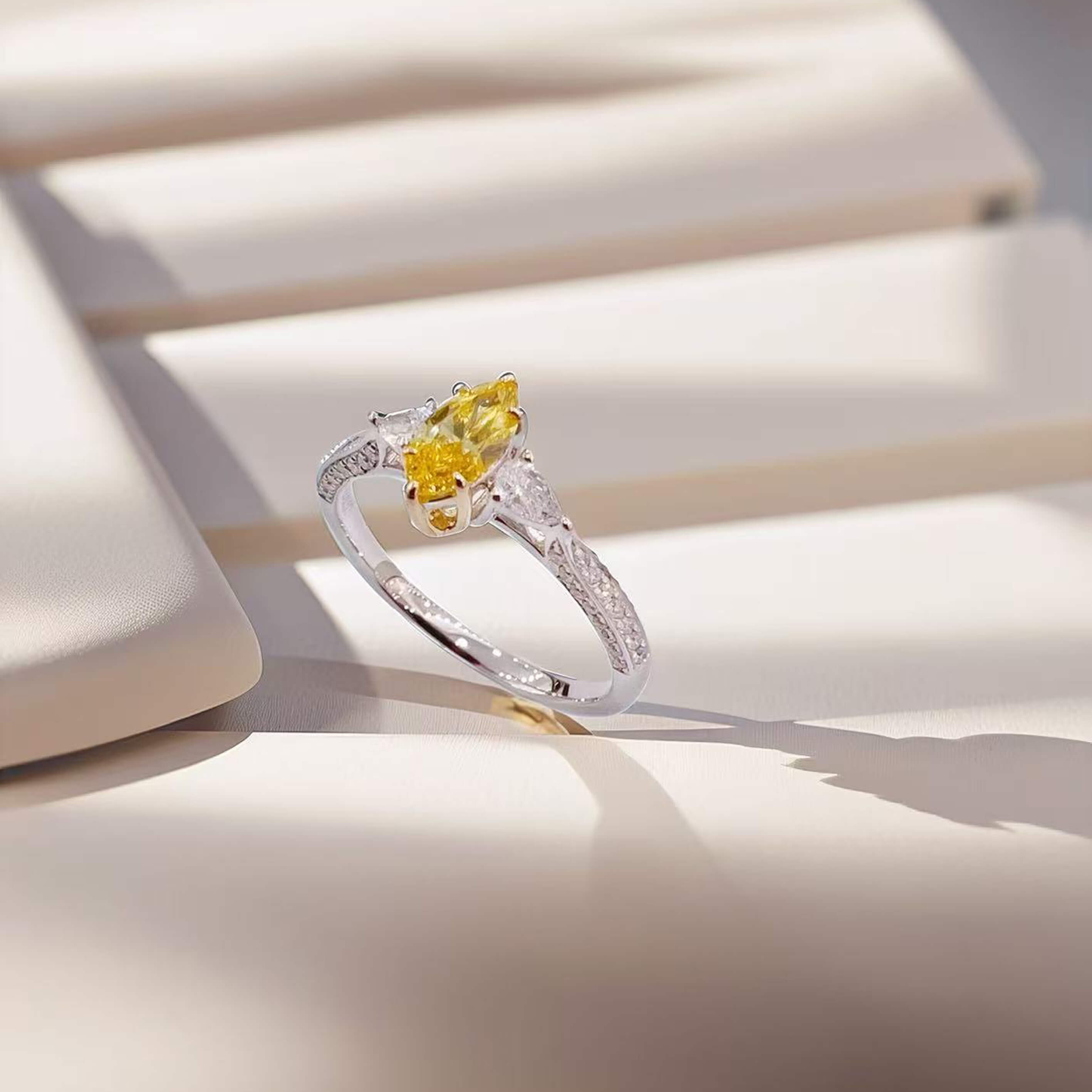 Marquise cut lab grown yellow diamond three stones engagement ring
