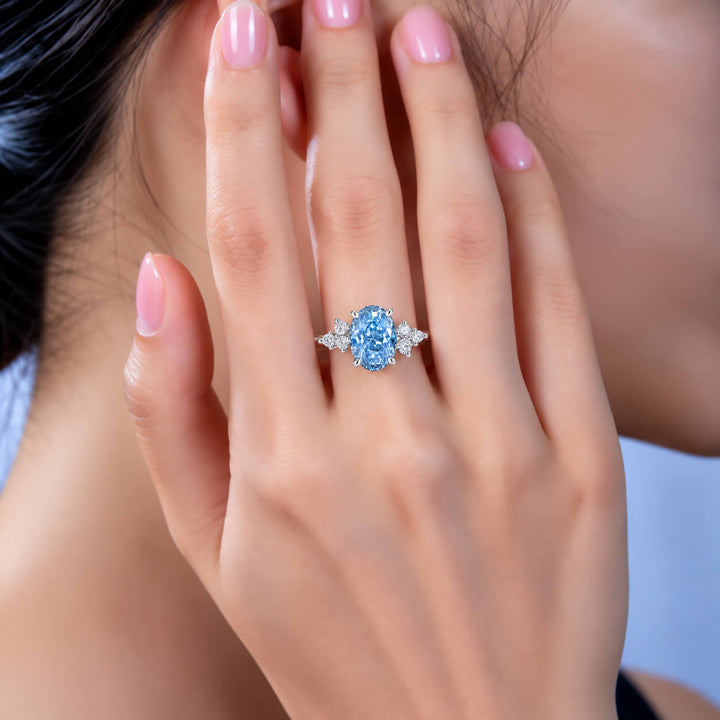 Oval cut lab grown blue diamond engagement ring