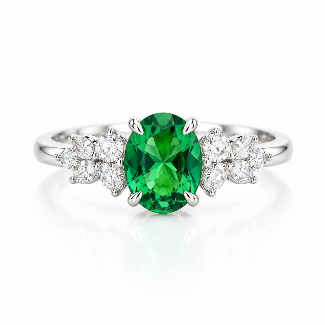 Oval cut lab grown emerald engagement ring