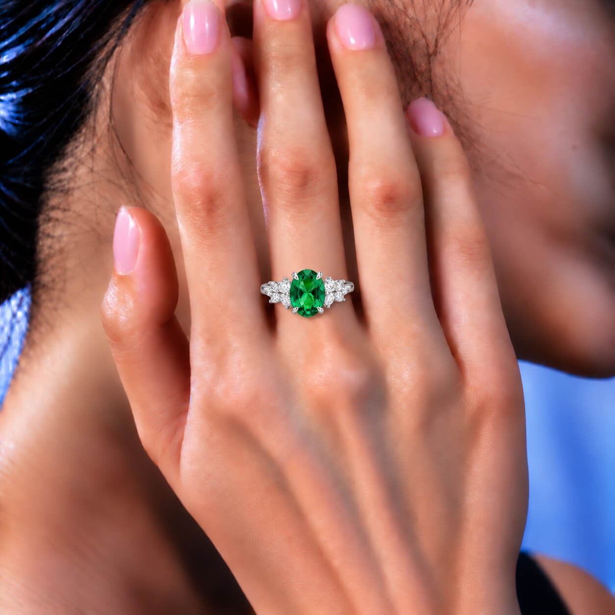 Oval cut lab grown emerald engagement ring