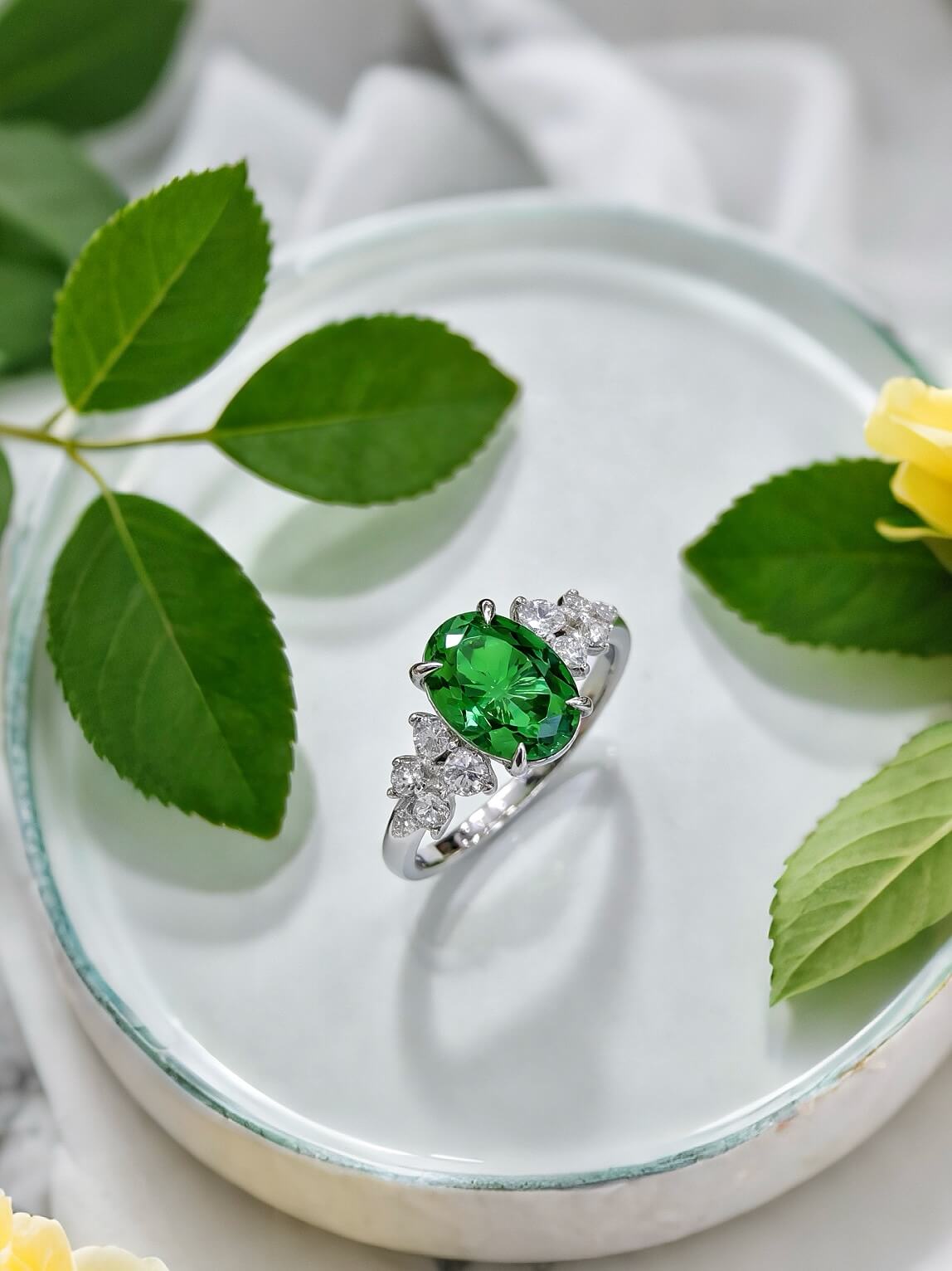Oval cut lab grown emerald engagement ring