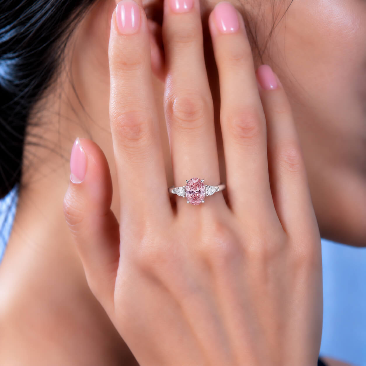 Oval cut lab grown pink diamond three stones engagement ring