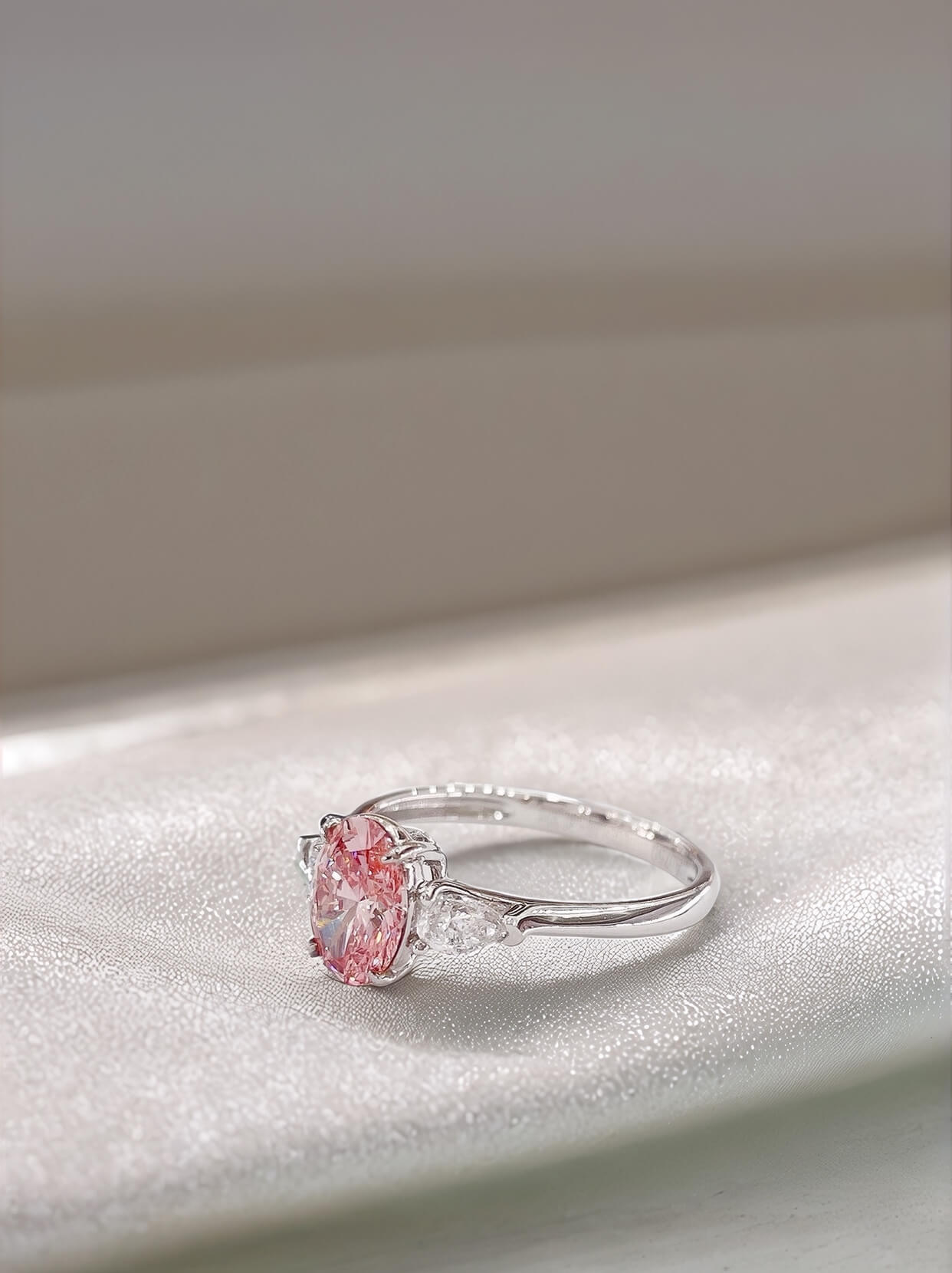 Oval cut lab grown pink diamond three stones engagement ring