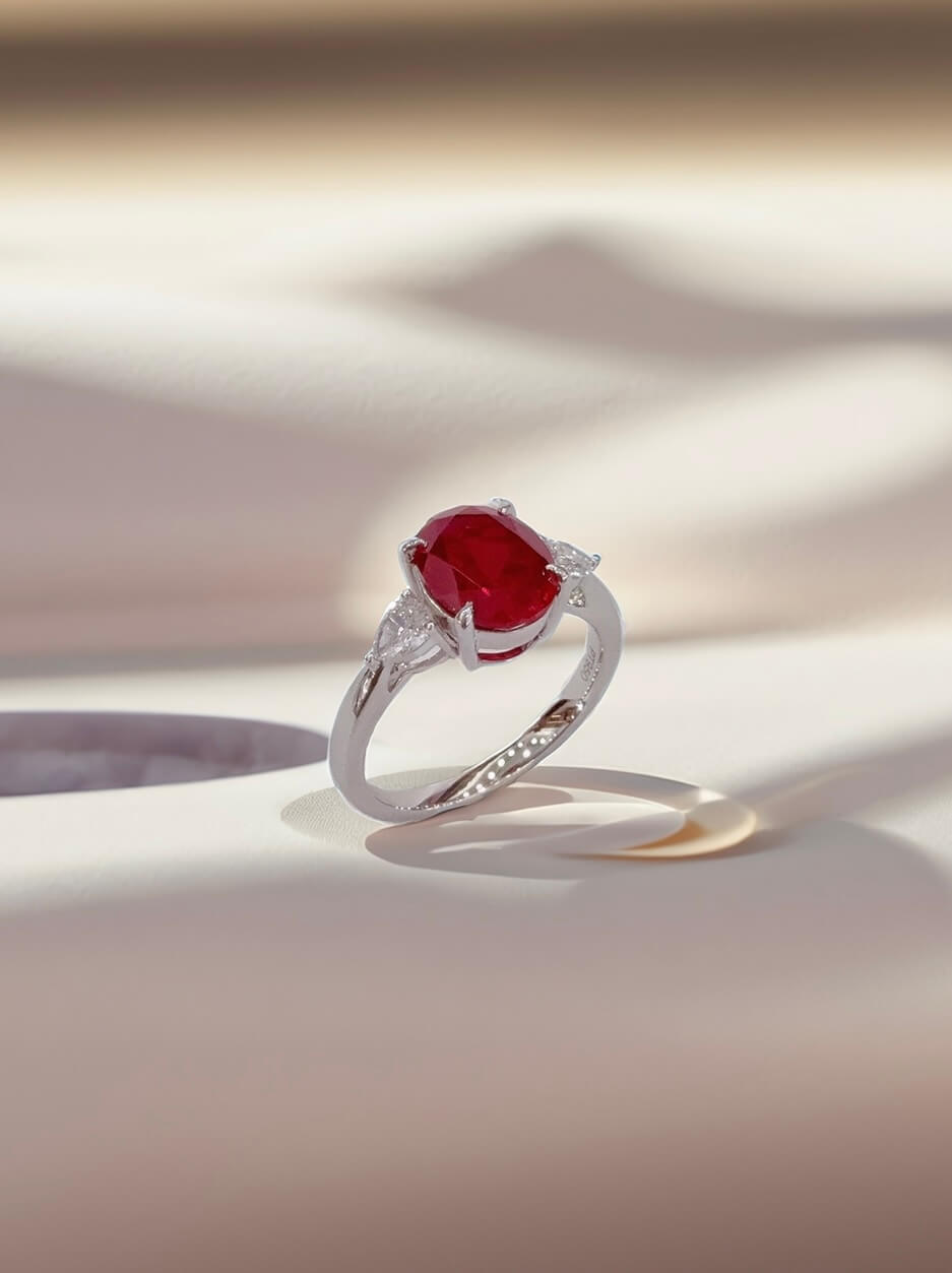 Oval cut lab grown ruby three stones engagement ring