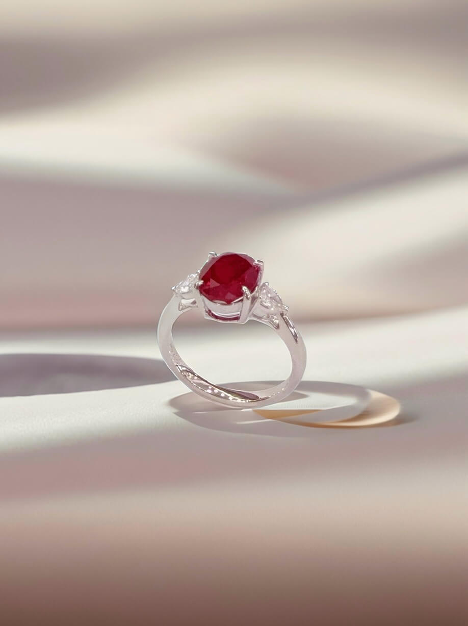 Oval cut lab grown ruby three stones engagement ring