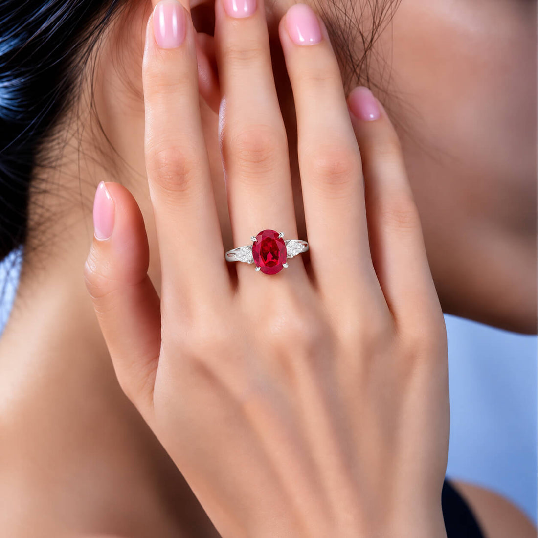 Oval cut lab grown ruby three stones engagement ring