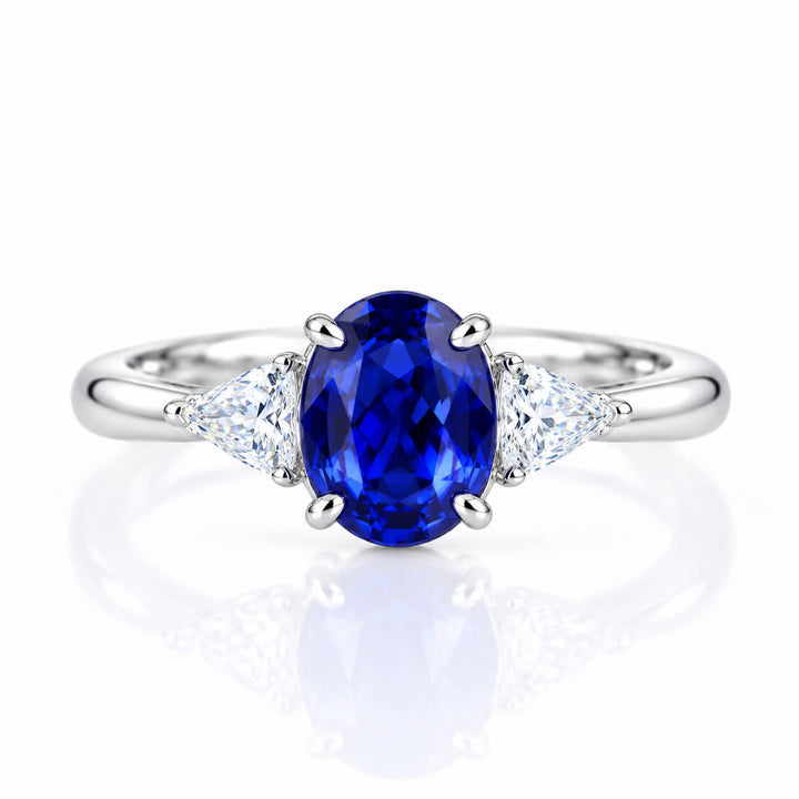 Oval cut  lab grown sapphire three stones engagement ring