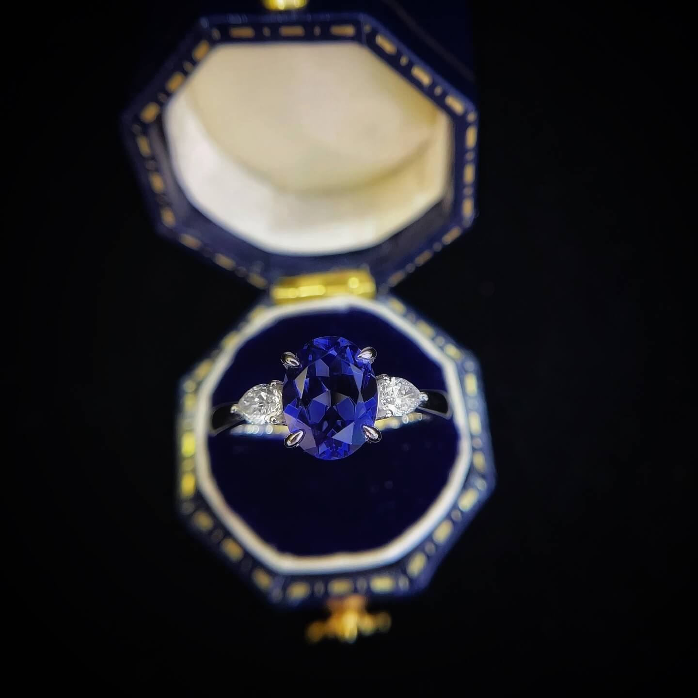 Oval cut  lab grown sapphire three stones engagement ring