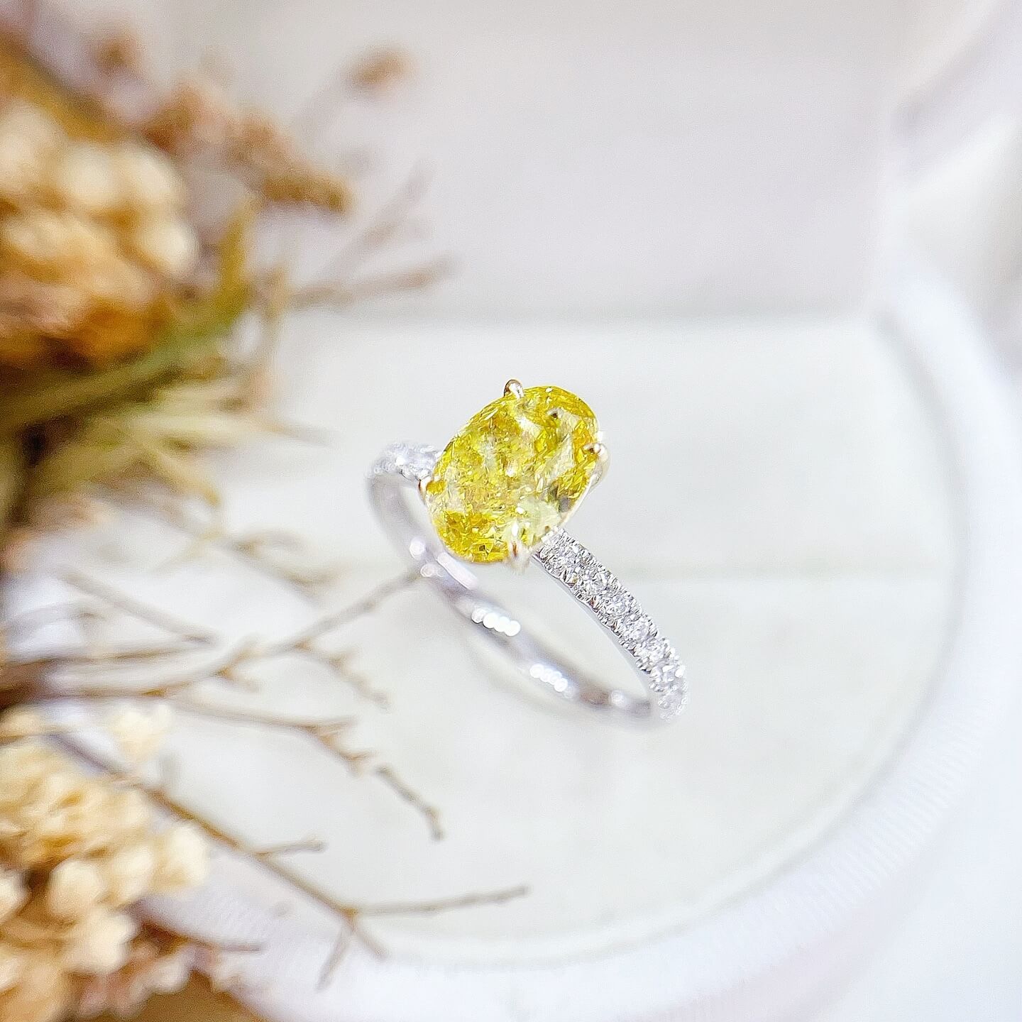Oval cut lab grown yellow diamond engagement ring