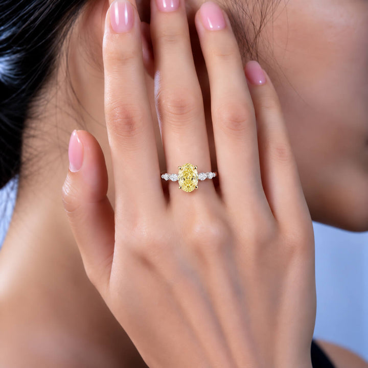 Oval cut lab grown yellow diamond engagement ring