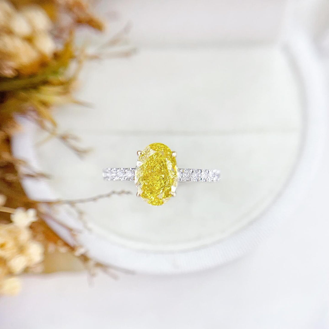 Oval cut lab grown yellow diamond engagement ring