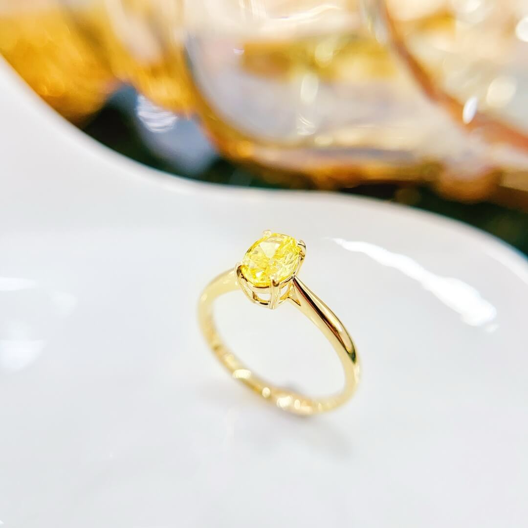 Oval cut lab grown yellow diamond engagement ring