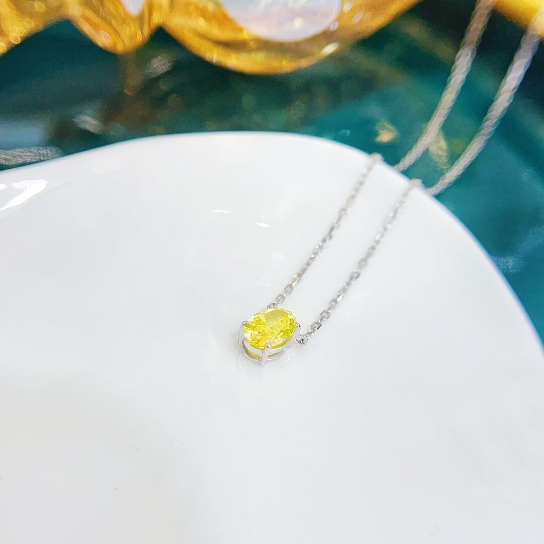 Oval cut lab grown yellow diamond pendant necklace