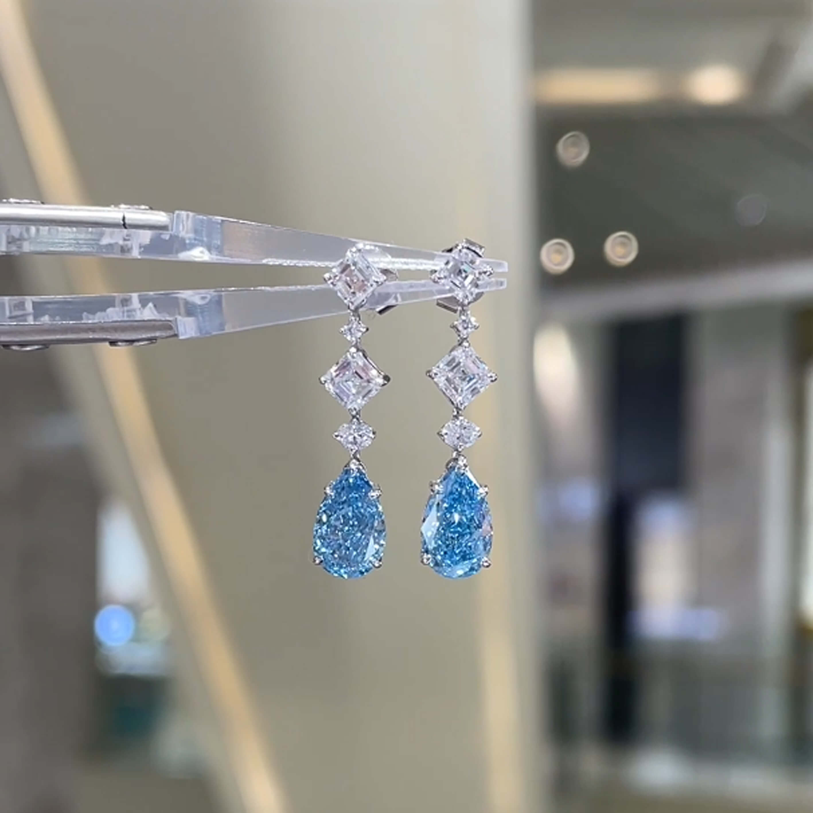 Pear cut lab grown blue diamond earrings stud