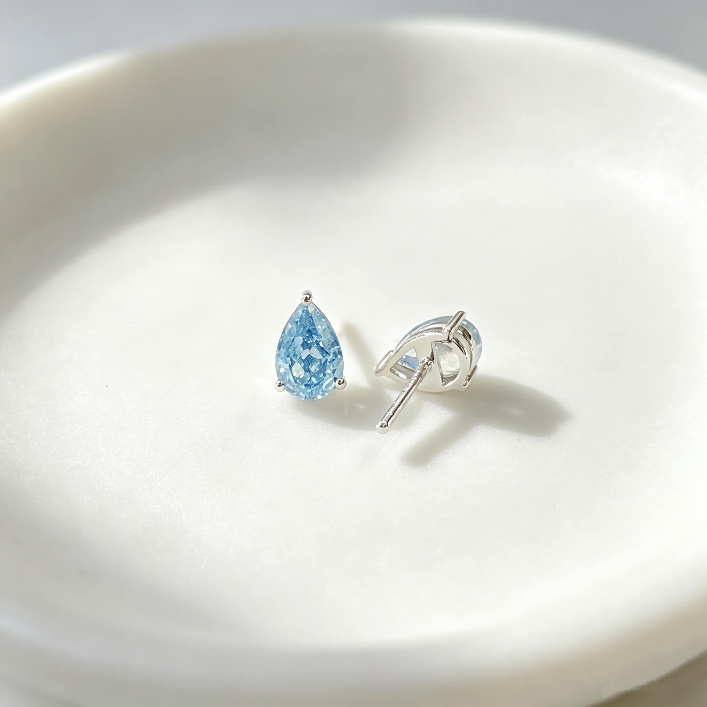 Pear cut lab grown blue diamond earrings stud