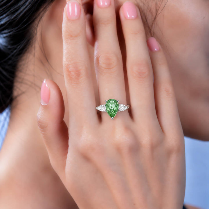 Pear cut lab grown diamond three stones engagement ring