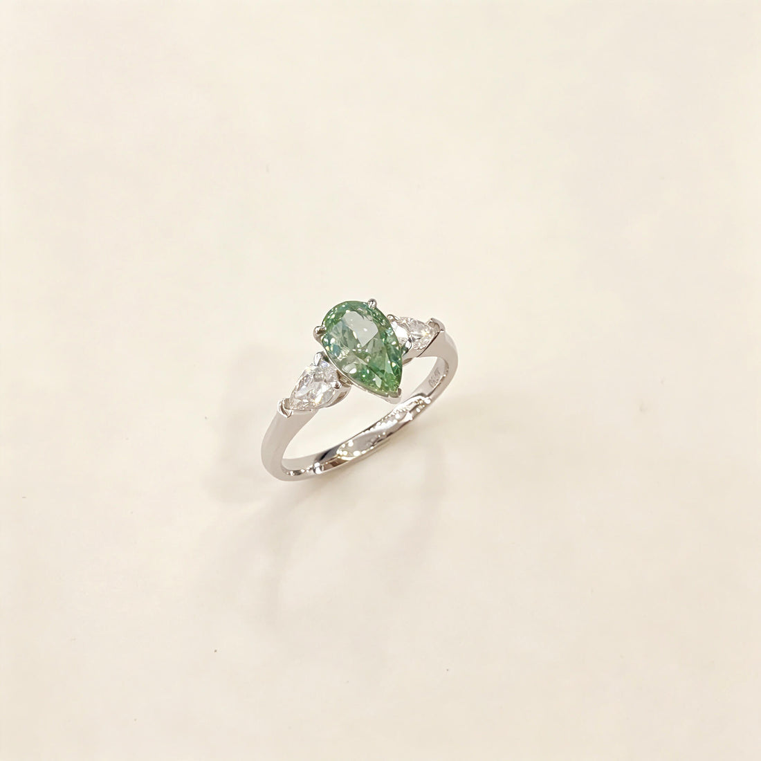 Pear cut lab grown diamond three stones engagement ring