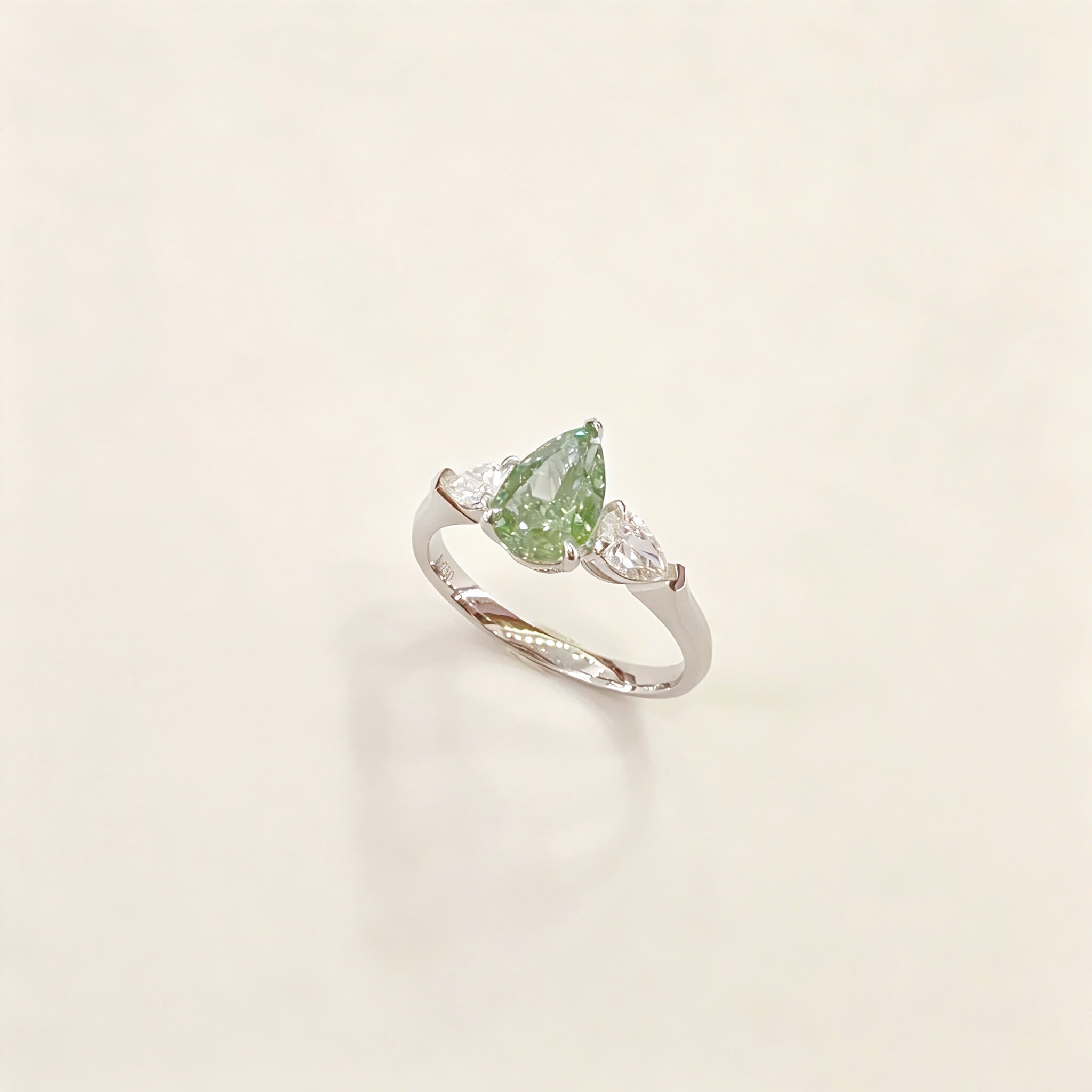 Pear cut lab grown diamond three stones engagement ring