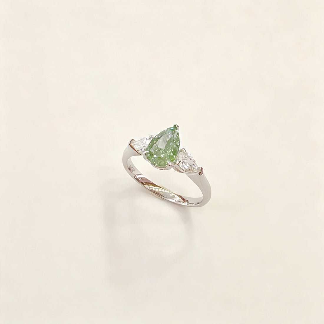 Pear cut lab grown diamond three stones engagement ring