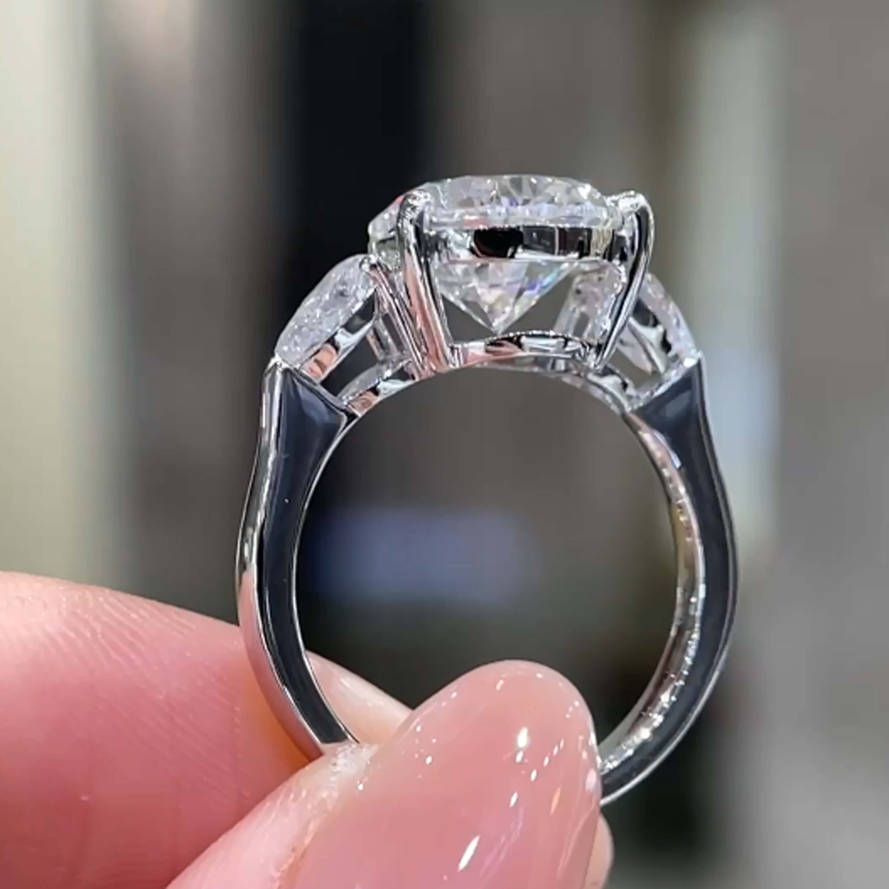 Pear cut lab grown diamond three stones engagement ring