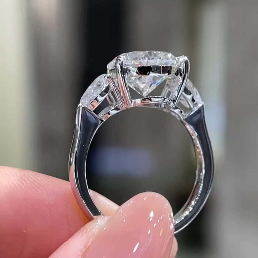 Pear cut lab grown diamond three stones engagement ring