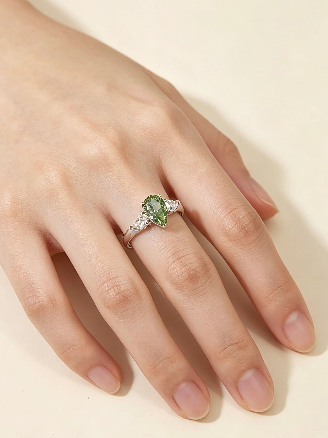 Pear cut lab grown diamond three stones engagement ring