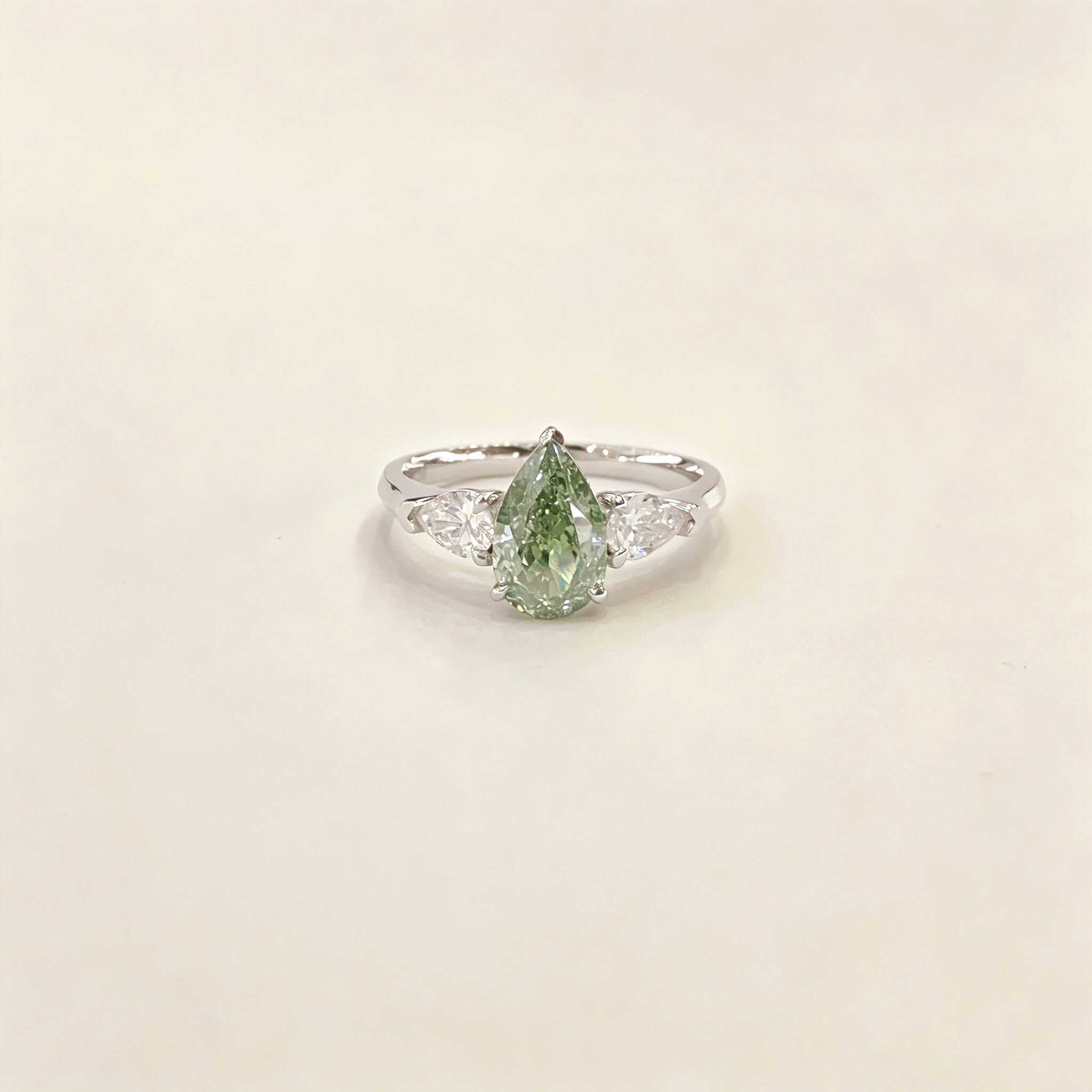 Pear cut lab grown diamond three stones engagement ring