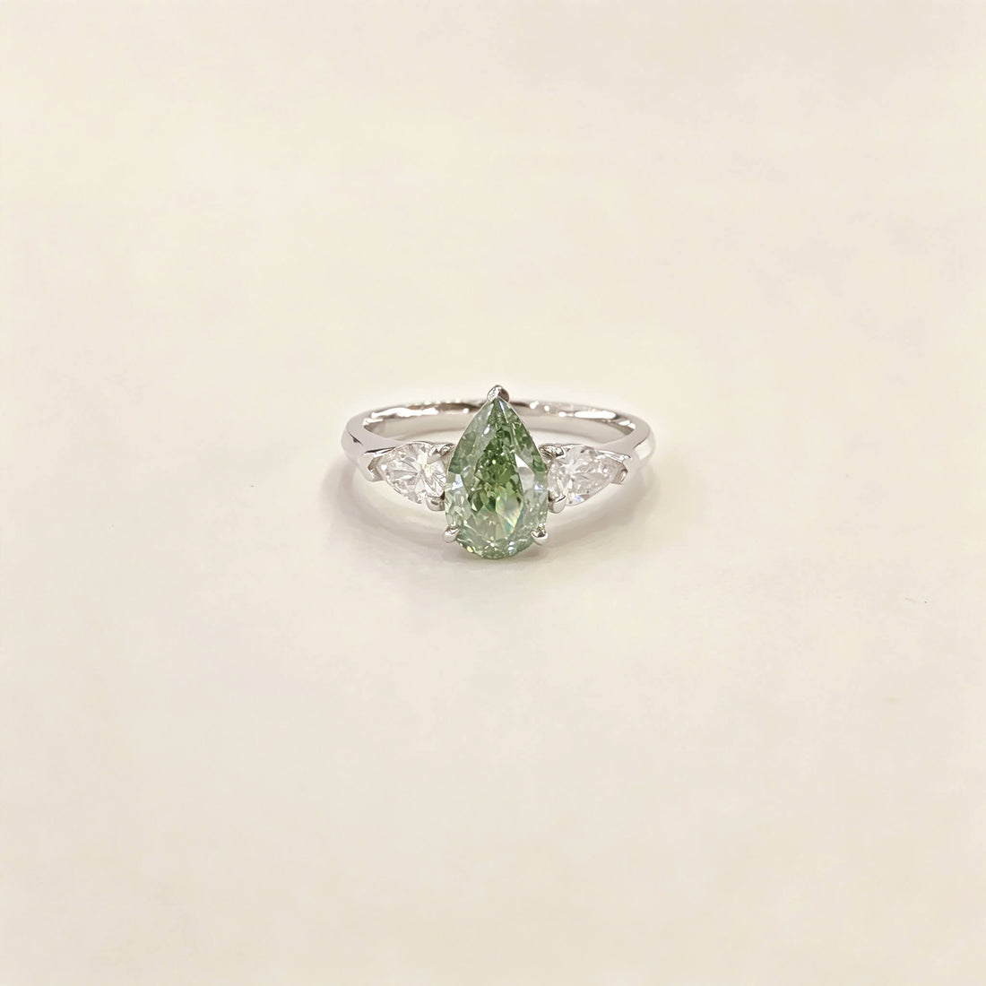 Pear cut lab grown diamond three stones engagement ring