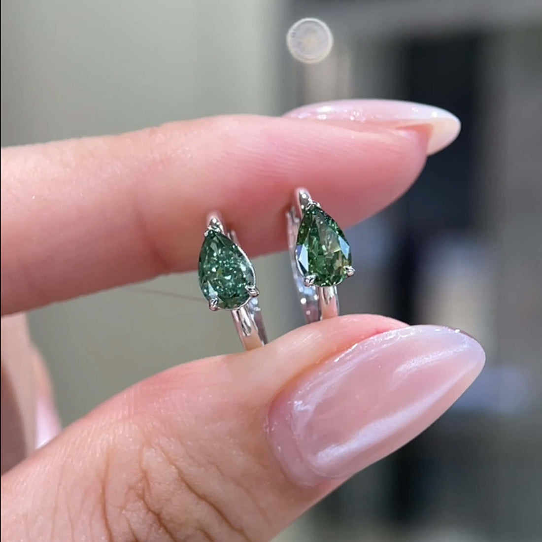 Pear cut lab grown green diamond hoop earrings