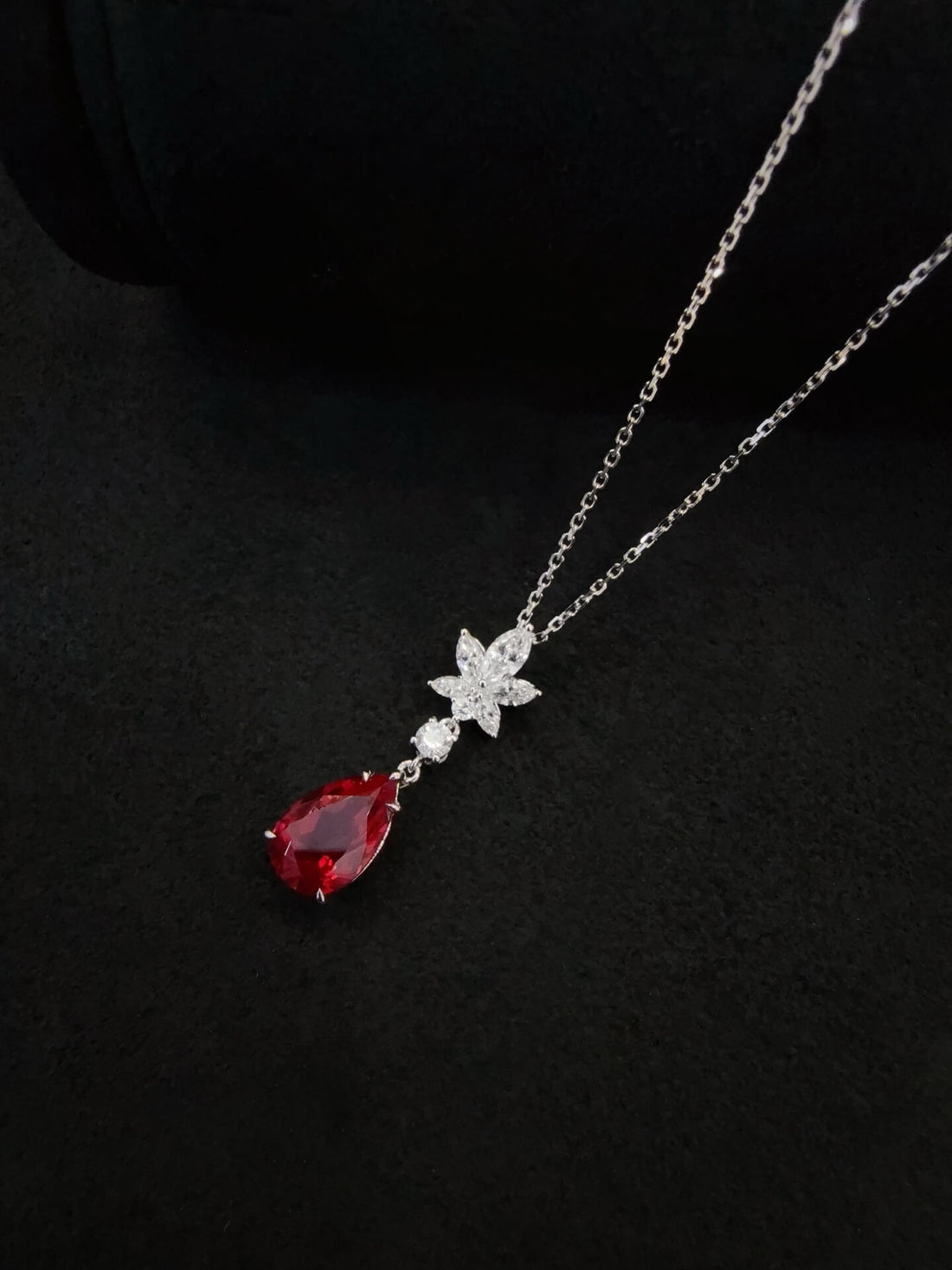Pear cut lab grown ruby pendant necklace
