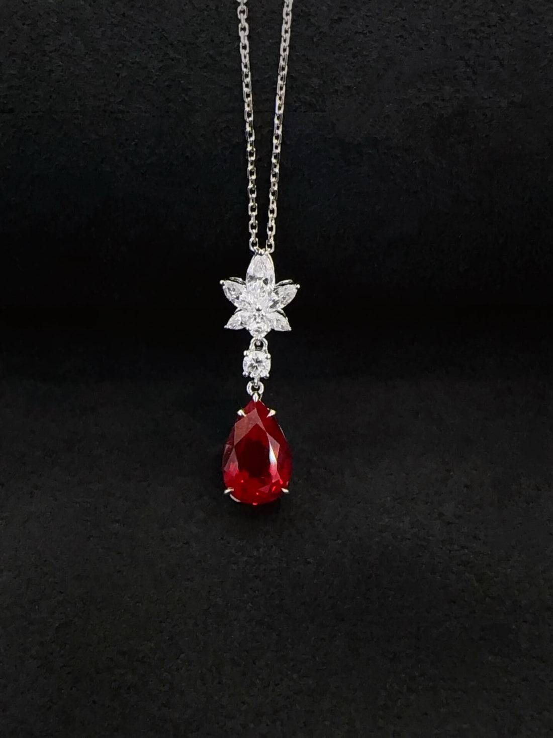 Pear cut lab grown ruby pendant necklace