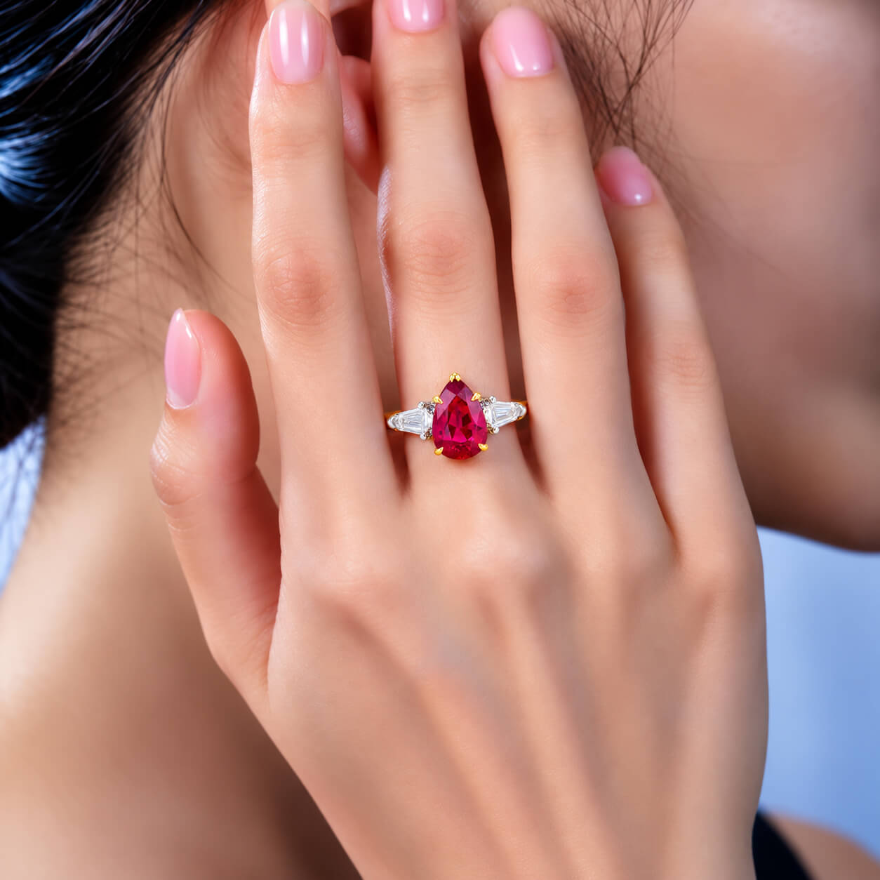 Pear cut lab grown ruby three stones engagement ring