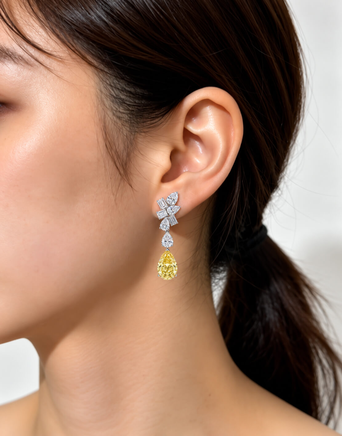 Pear cut lab grown yellow diamond earrings stud