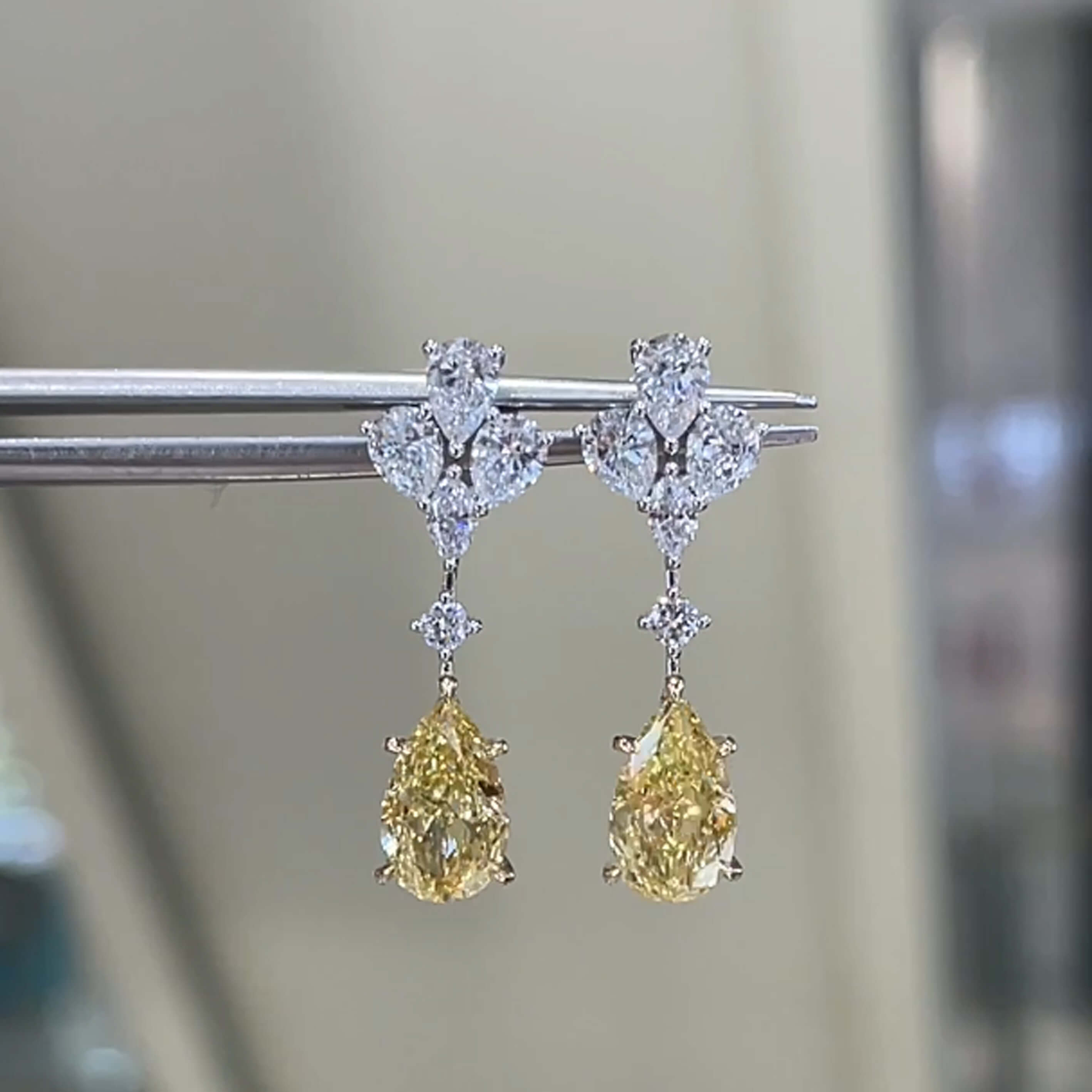 Pear cut lab grown yellow diamond earrings stud