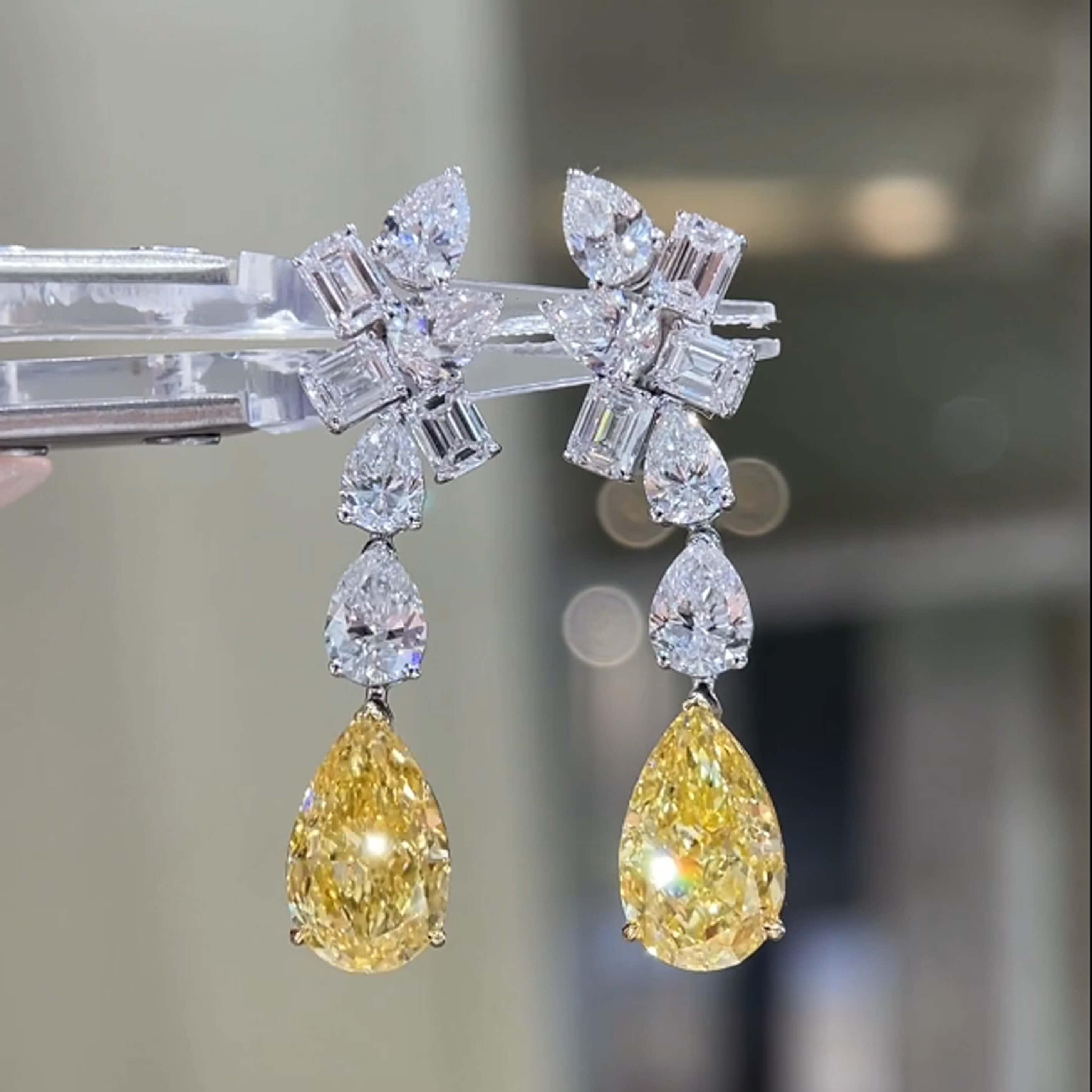 Pear cut lab grown yellow diamond earrings stud