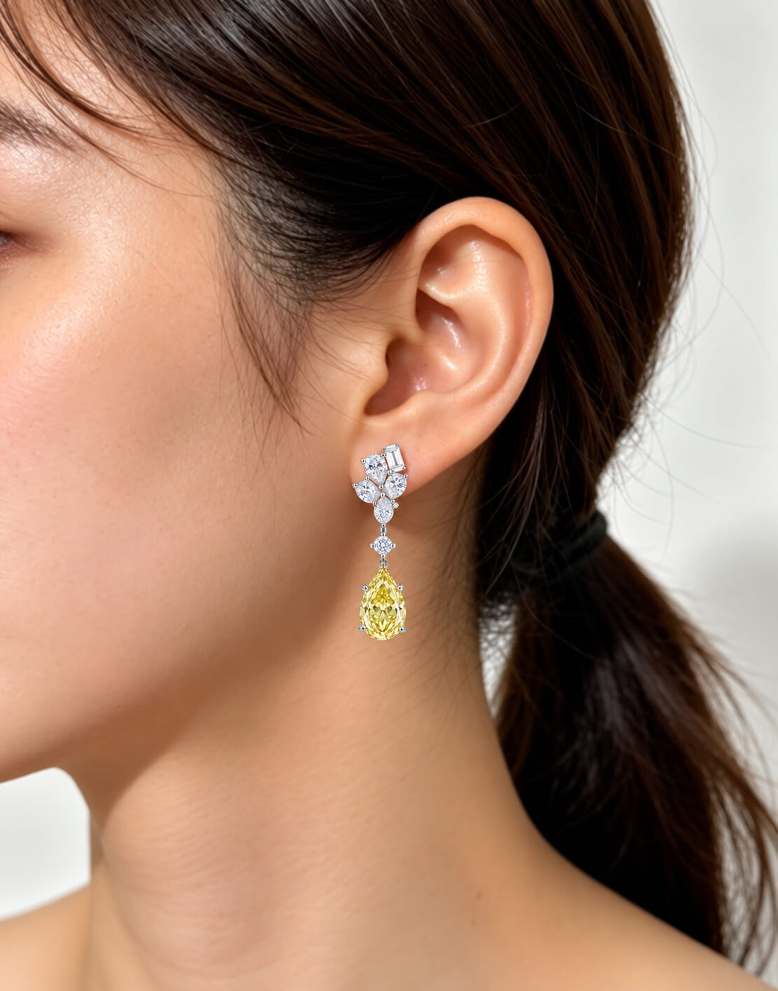 Pear cut lab grown yellow diamond earrings stud