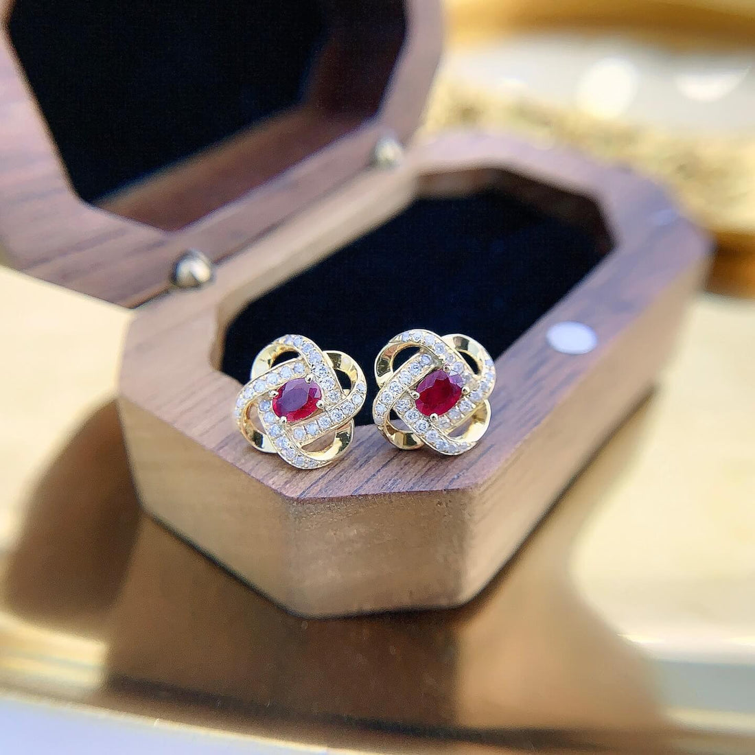 Planet orbit design oval cut lab grown ruby earrings stud