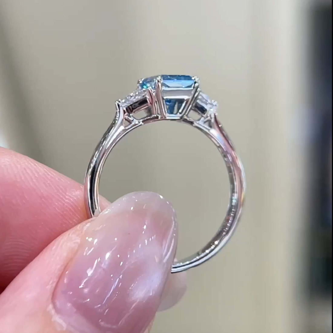 Radiant cut lab grown blue diamond three stones engagement ring