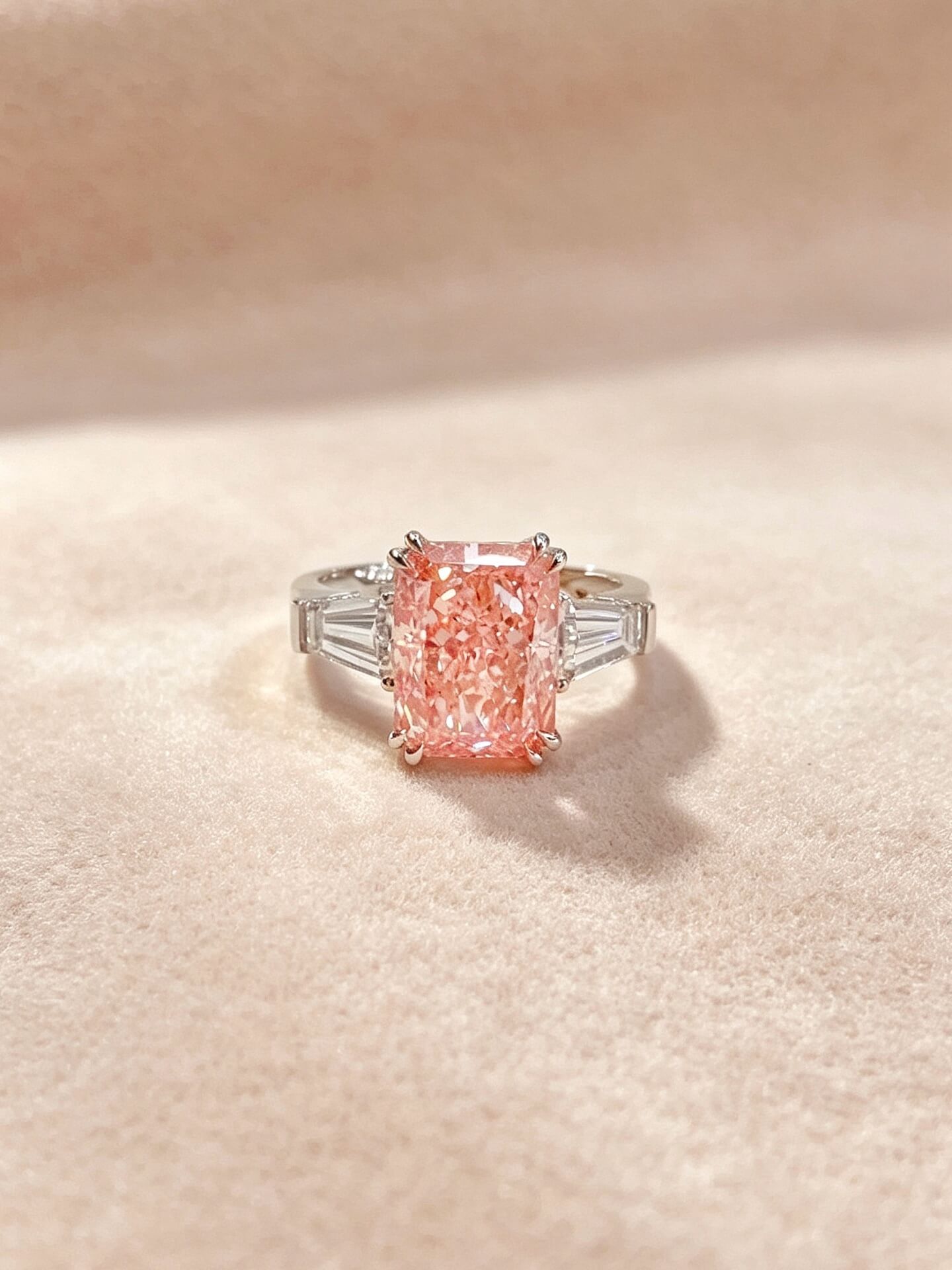 Radiant cut lab grown pink diamond three stones engagement ring