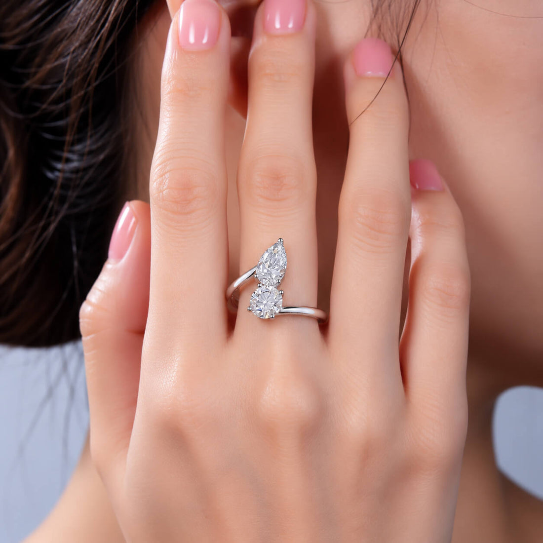 Round and pear cut lab grown diamond engagement ring