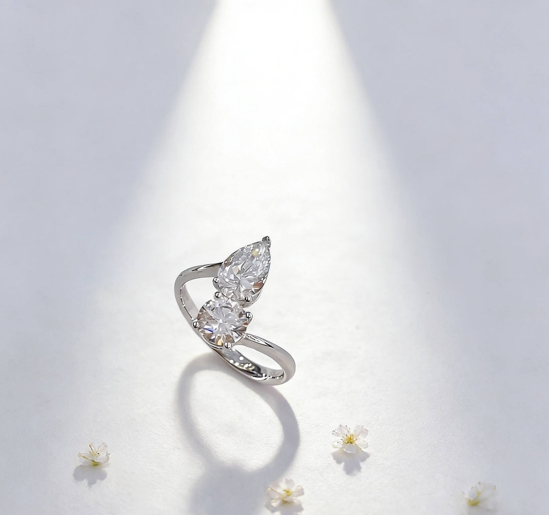 Round and pear cut lab grown diamond engagement ring