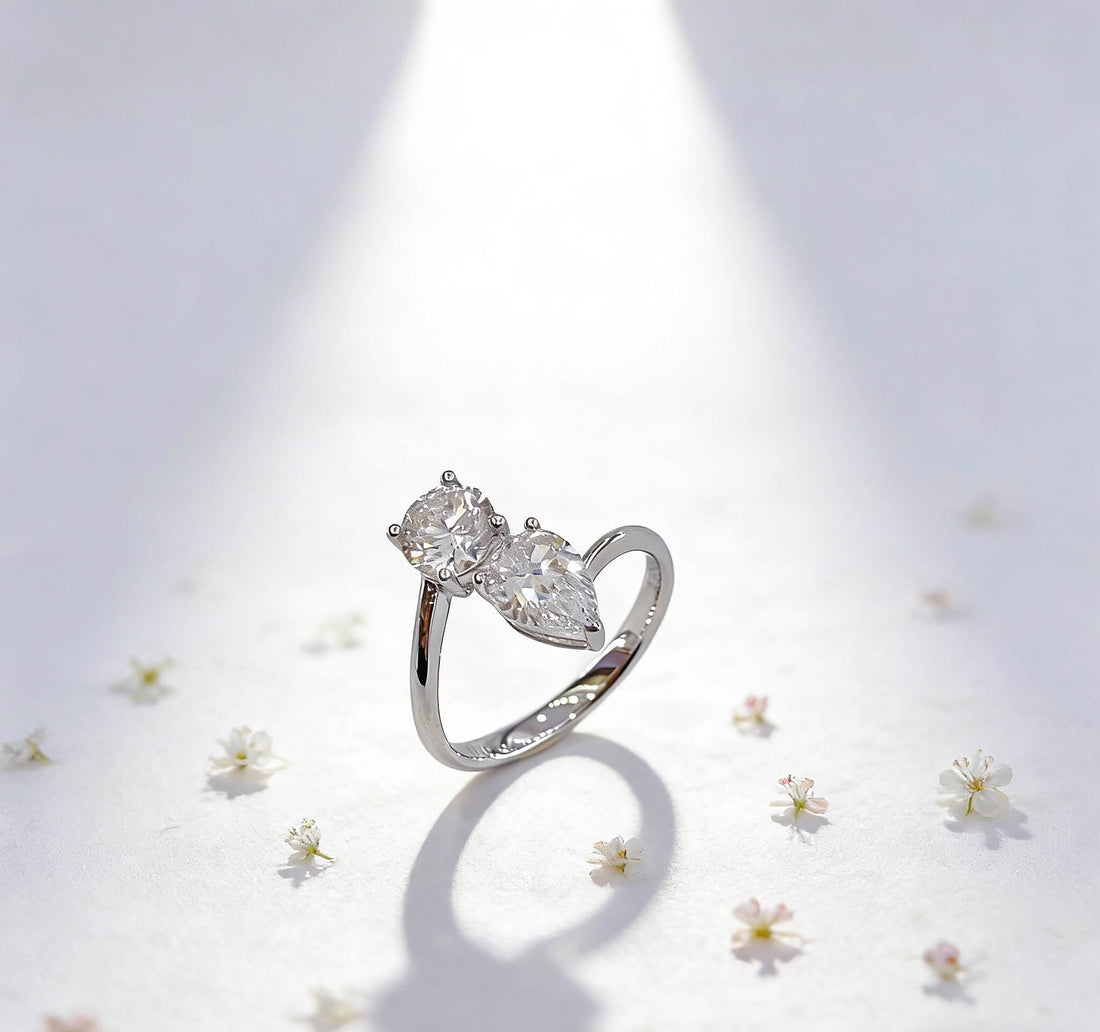 Round and pear cut lab grown diamond engagement ring