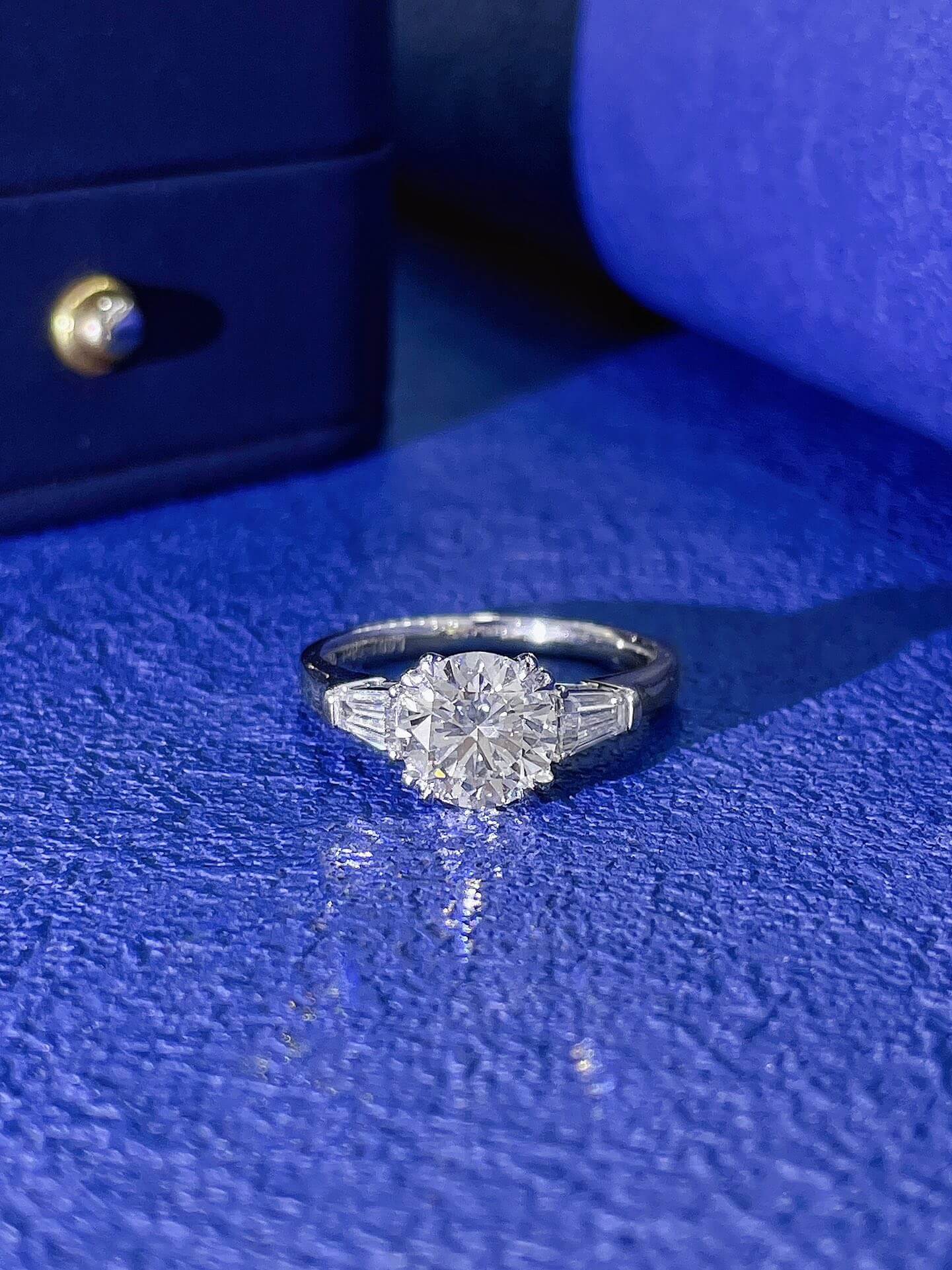 Round cut lab grown diamond three stones engagement ring
