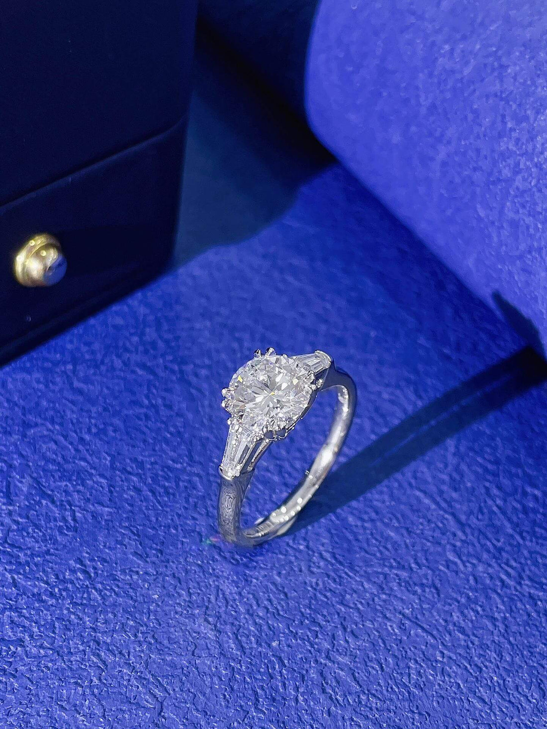 Round cut lab grown diamond three stones engagement ring