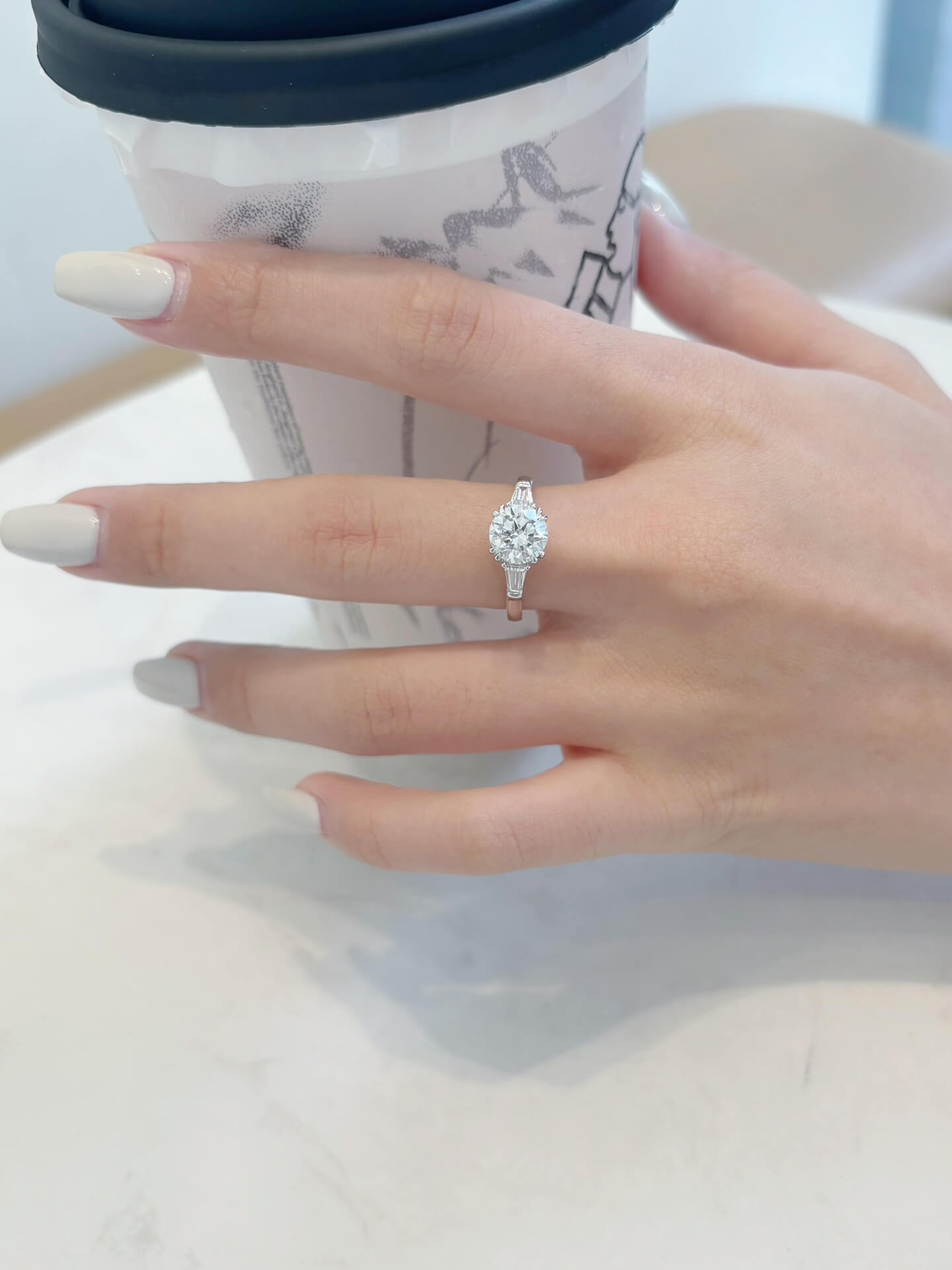Round cut lab grown diamond three stones engagement ring